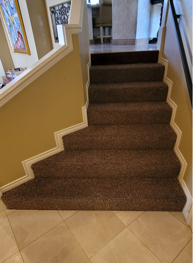 20220406_113754 2 a staircase with carpeted steps