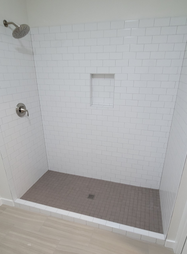 20220913_154627 3 a shower with a tile floor