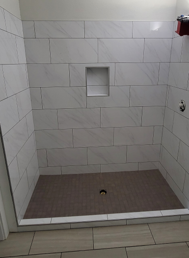 20220915_111156 3 (1) a shower with a tile floor