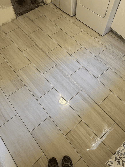 Beautiful beige ceramic floor tiles in a modern kitchen setting.